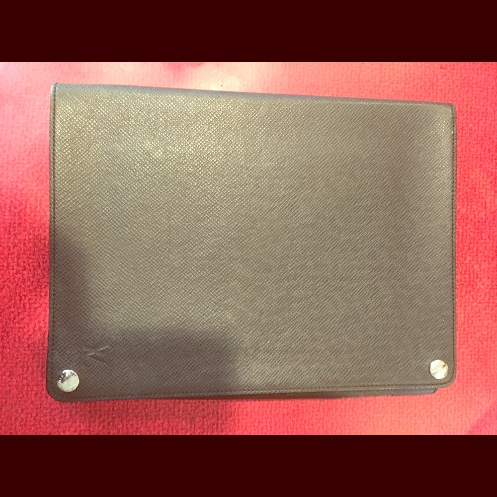 Authentic used Louis Vuitton Taiga iPad case.